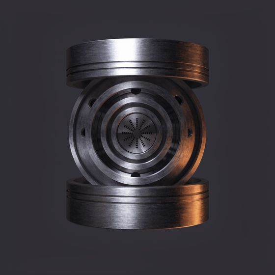 Cast metal stack of lenses and apertures